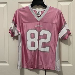 Pink Dallas Cowboys jersey, size medium in kids, number 82, Jason Witten.